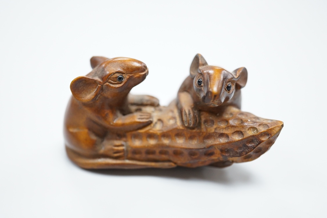 Three carved hardwood netsuke, signed